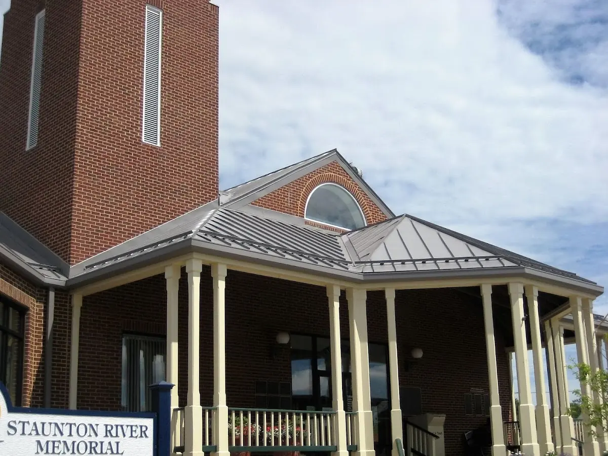 Skilled roofing craftsmen working on a residential roof in River Rouge